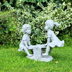 Garden Ornament Boy and Girl playing on a Seesaw