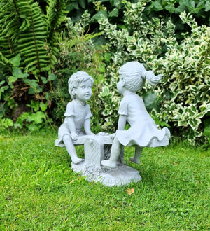 Garden Ornament Boy and Girl playing on a Seesaw