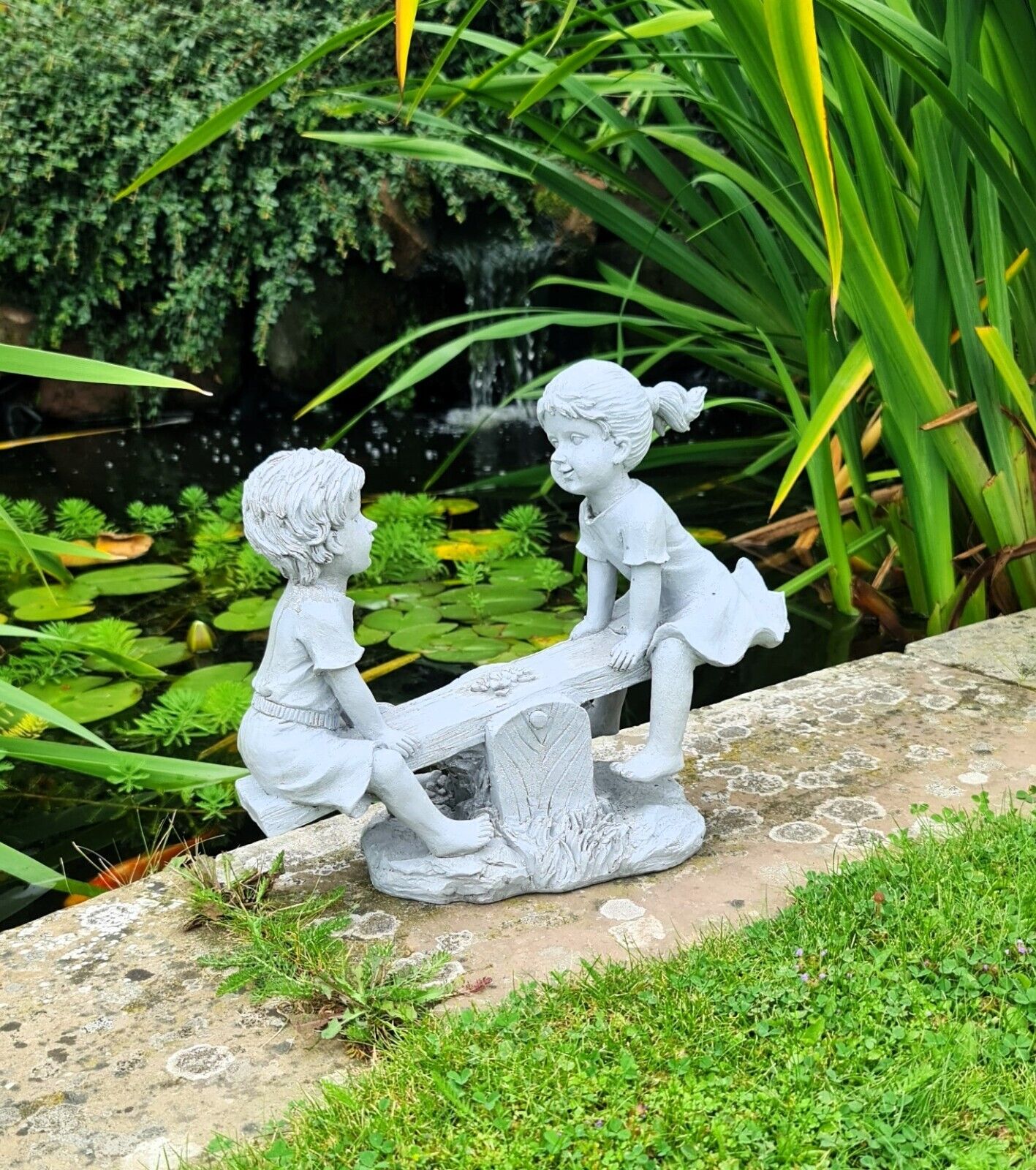 Garden Ornament Boy and Girl playing on a Seesaw