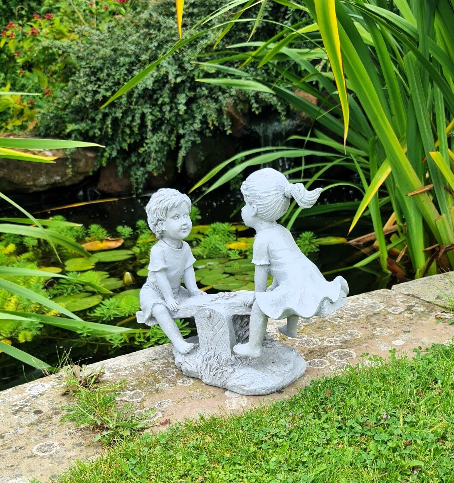 Garden Ornament Boy and Girl playing on a Seesaw