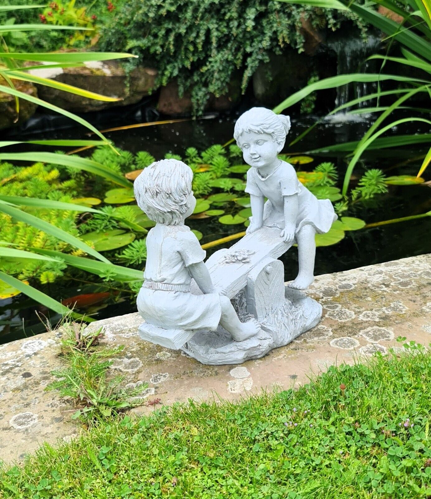 Garden Ornament Boy and Girl playing on a Seesaw