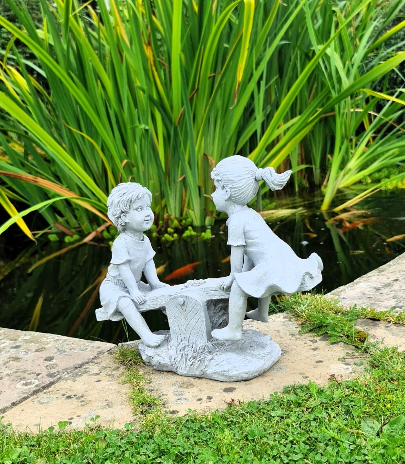 Garden Ornament Boy and Girl playing on a Seesaw