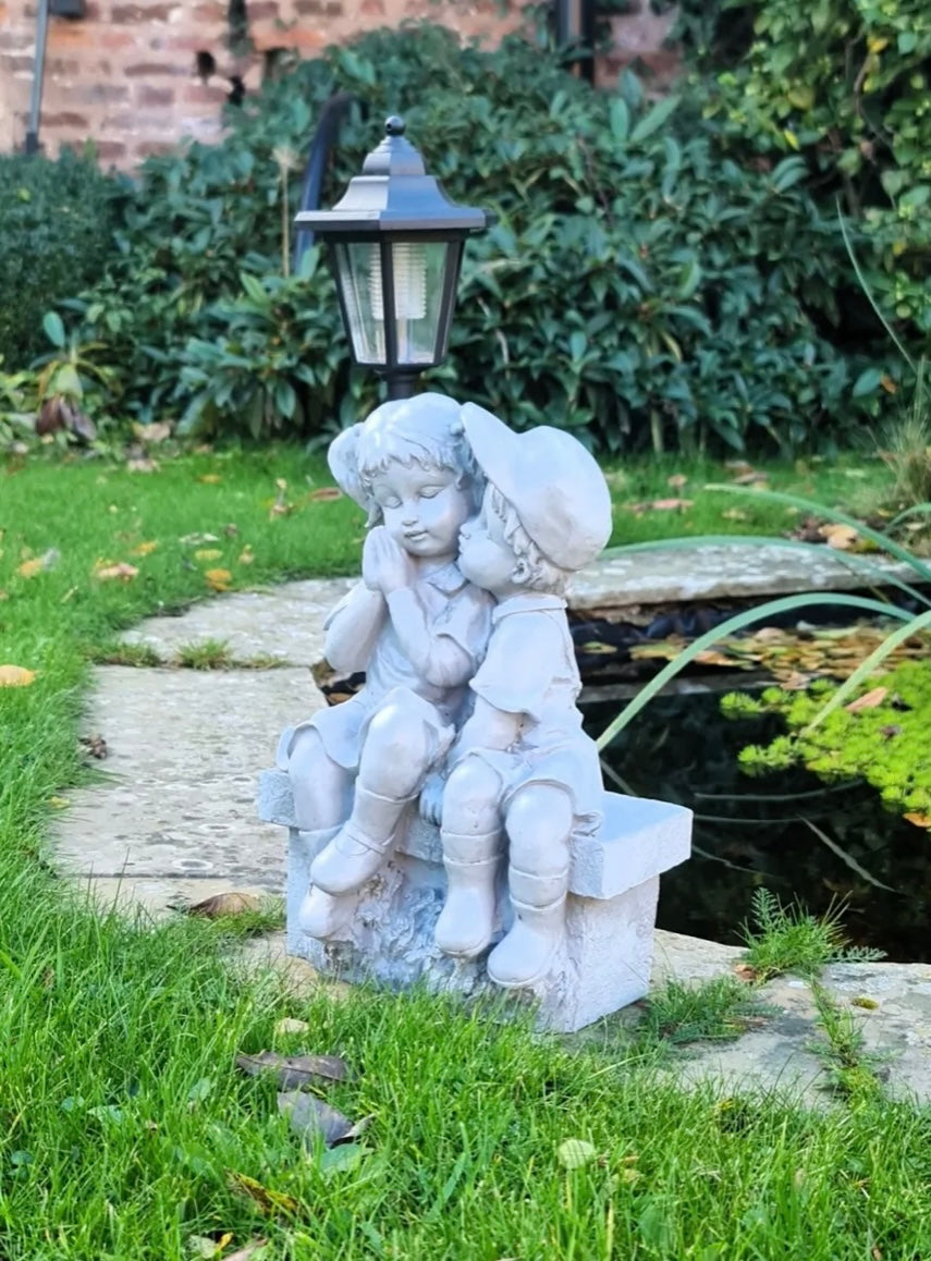 Solar Garden Ornament Boy and Girl Kissing on a Bench