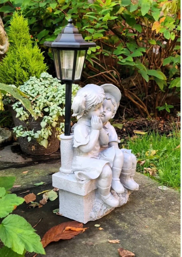 Solar Garden Ornament Boy and Girl Kissing on a Bench