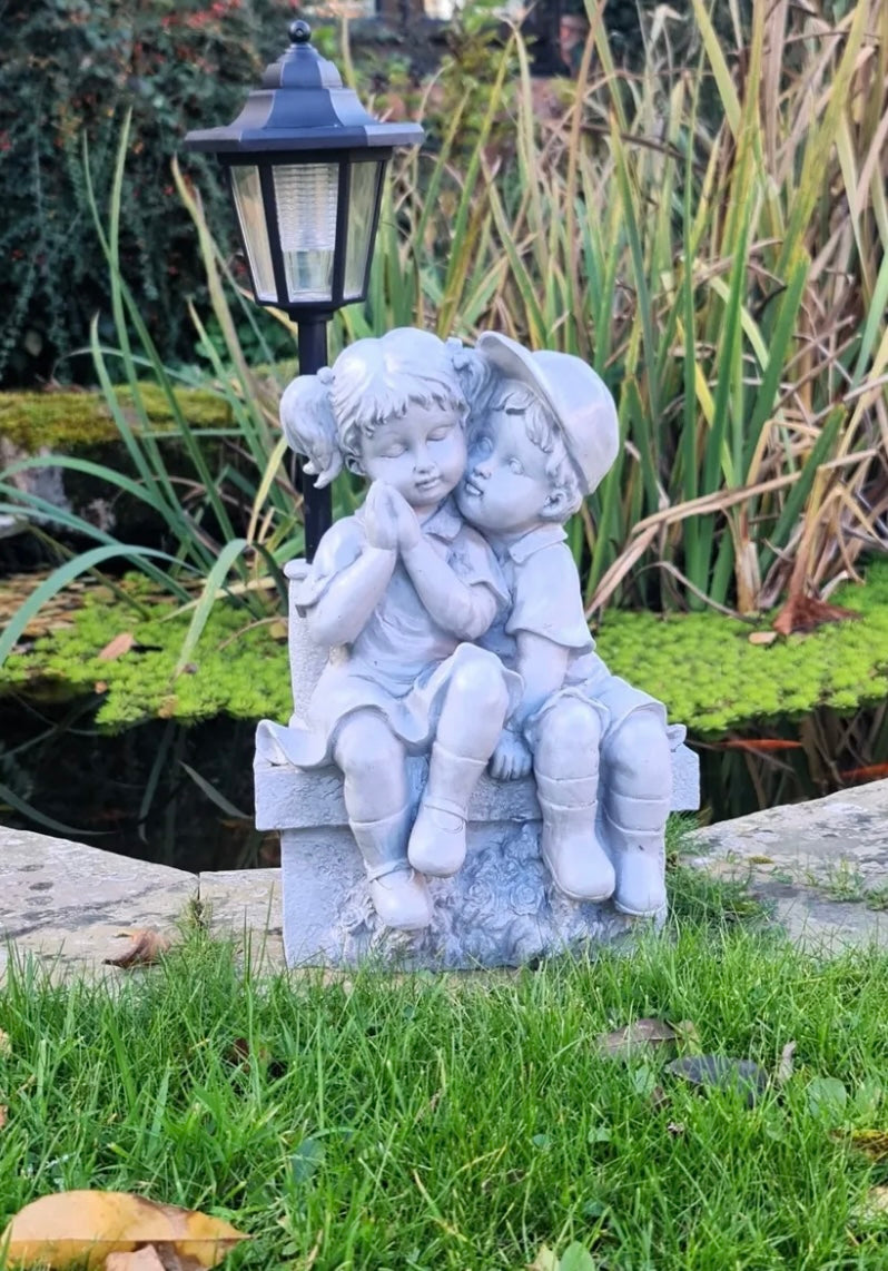 Solar Garden Ornament Boy and Girl Kissing on a Bench