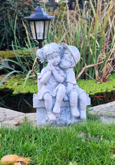 Solar Garden Ornament Boy and Girl Kissing on a Bench