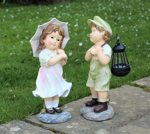 Little Girl with An Umbrella And Boy with Solar Light