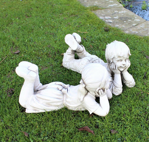 2 Large Lying Boy & Girl Statues