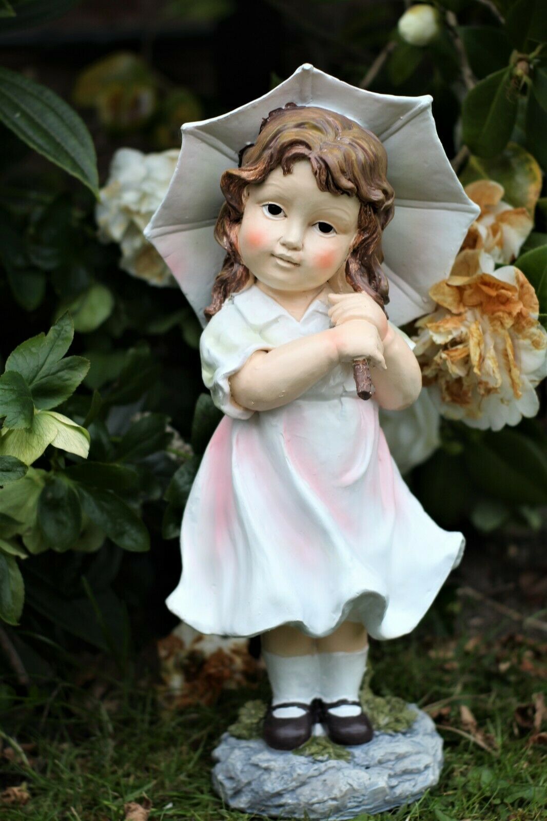 Little Girl with An Umbrella And Boy with Solar Light