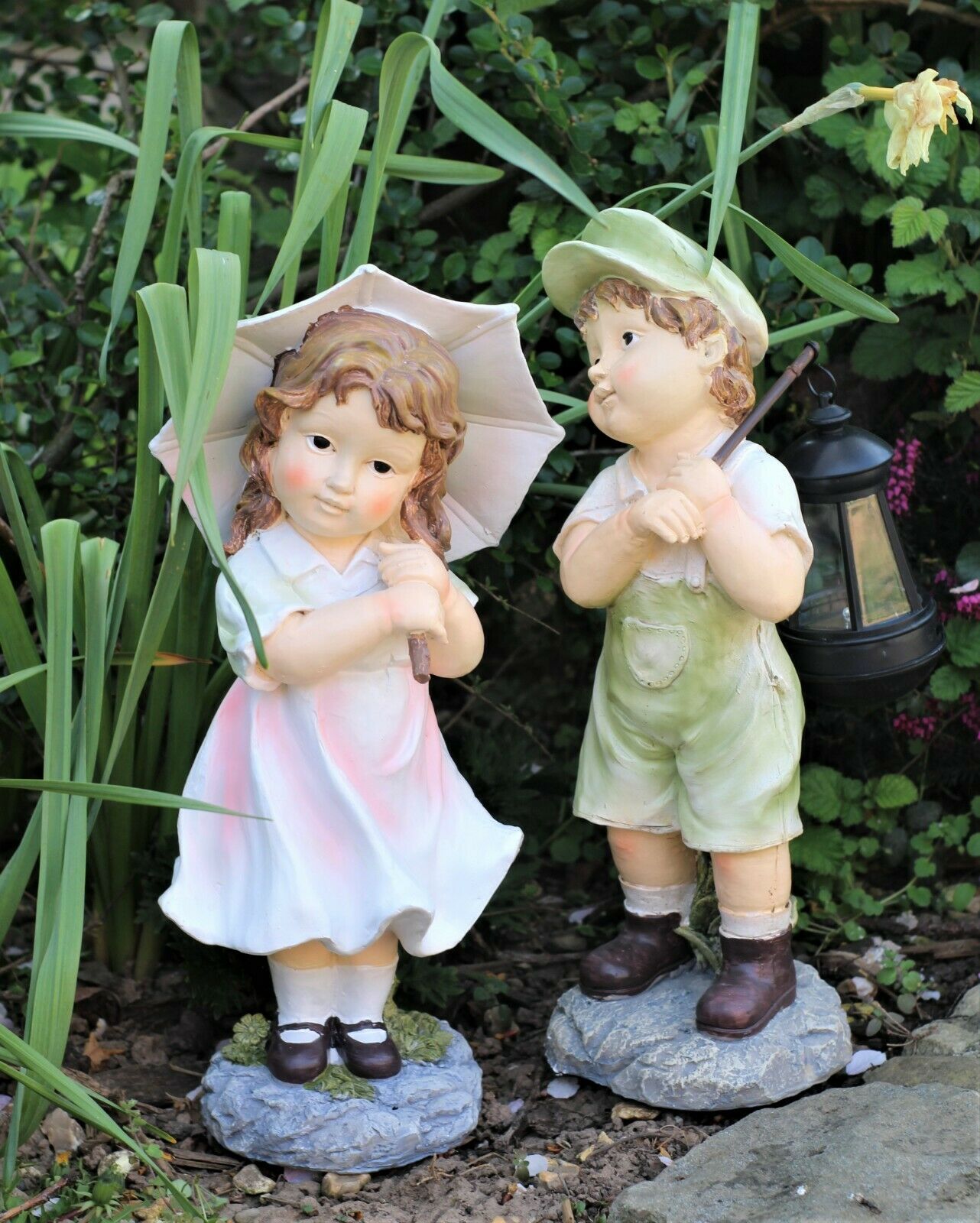 Little Girl with An Umbrella And Boy with Solar Light